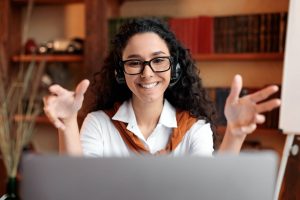Young female teacher having video conference call